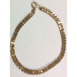 A VINTAGE 9CT GOLD FANCY LINK BRACELET Having an unusual box link style design and hook and eye