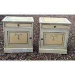 A PAIR OF CONTINENTAL BEDSIDE CABINETS with single drawer above cupboard painted with swags on a