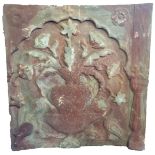 A LARGE DECORATIVE ANTIQUE INDIAN STONE PANEL Carved in relief with flowers in a vase and other