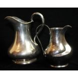 A 20TH CENTURY ITALIAN SILVER CREAM JUG Having a planished finish with stylized spout and marked