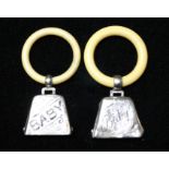 TWO EDWARDIAN SILVER AND IVORY CHILD'S BELL FORM RATTLES/TEETHING RINGS Engraved declaration,