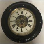 AN EARLY 20TH CENTURY EBONISED SKELETON WALL CLOCK The twin train movement and Roman numeral chapter