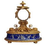 A 19TH CENTURY GILT METAL AND PORCUPINE MANTEL CLOCK The case decorated with cherubs and satyr
