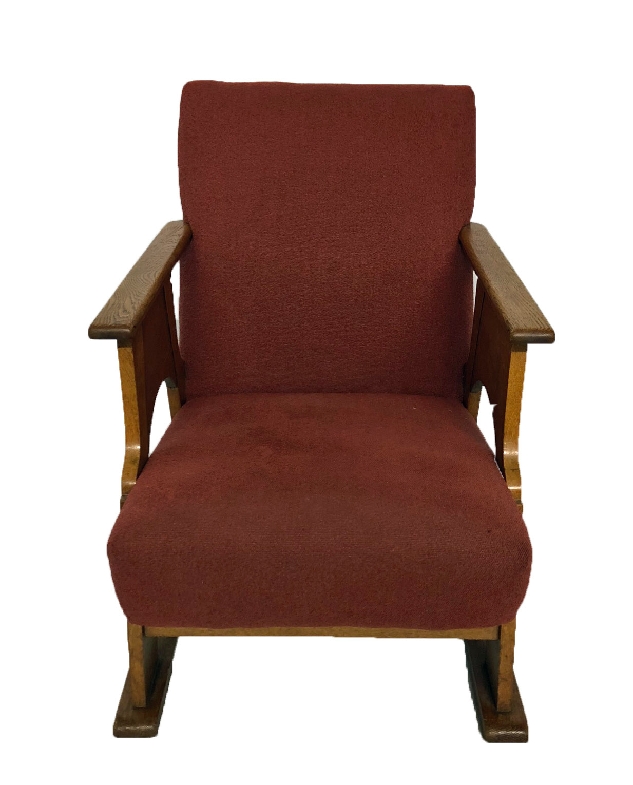 AN EARLY 20TH CENTURY COTSWOLD SCHOOL CARVED OAK UPHOLSTERED ARMCHAIR.