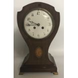 A LARGE EARLY 20TH CENTURY MAHOGANY INLAID BALLOON CLOCK With twin train movement striking on a