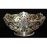 AN EARLY 20TH CENTURY PIERCED SILVER BOWL With gadrooned border set with shells, the body pierced