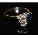 A VINTAGE PLATINUM, DIAMOND AND SAPPHIRE HALF TWIST RING The single round cut stones set with two