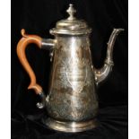 A GEORGE II SILVER TAPERING CYLINDRICAL COFFEE POT With engraved chased decoration, bearing an