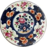 AN 18TH CENTURY CHINESE PORCELAIN PLATE Hand painted with a floral display in Imari coloured pallet.