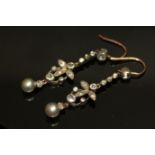 A VINTAGE PAIR OF WHITE METAL, SEED PEARL AND PASTE FLORAL DROP EARRINGS Set with round cut paste