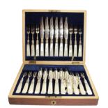 A CASED SET OF TWELVE EARLY 20TH CENTURY SILVER PLATED AND MOTHER OF PEARL FRUIT KNIVES AND FORKS