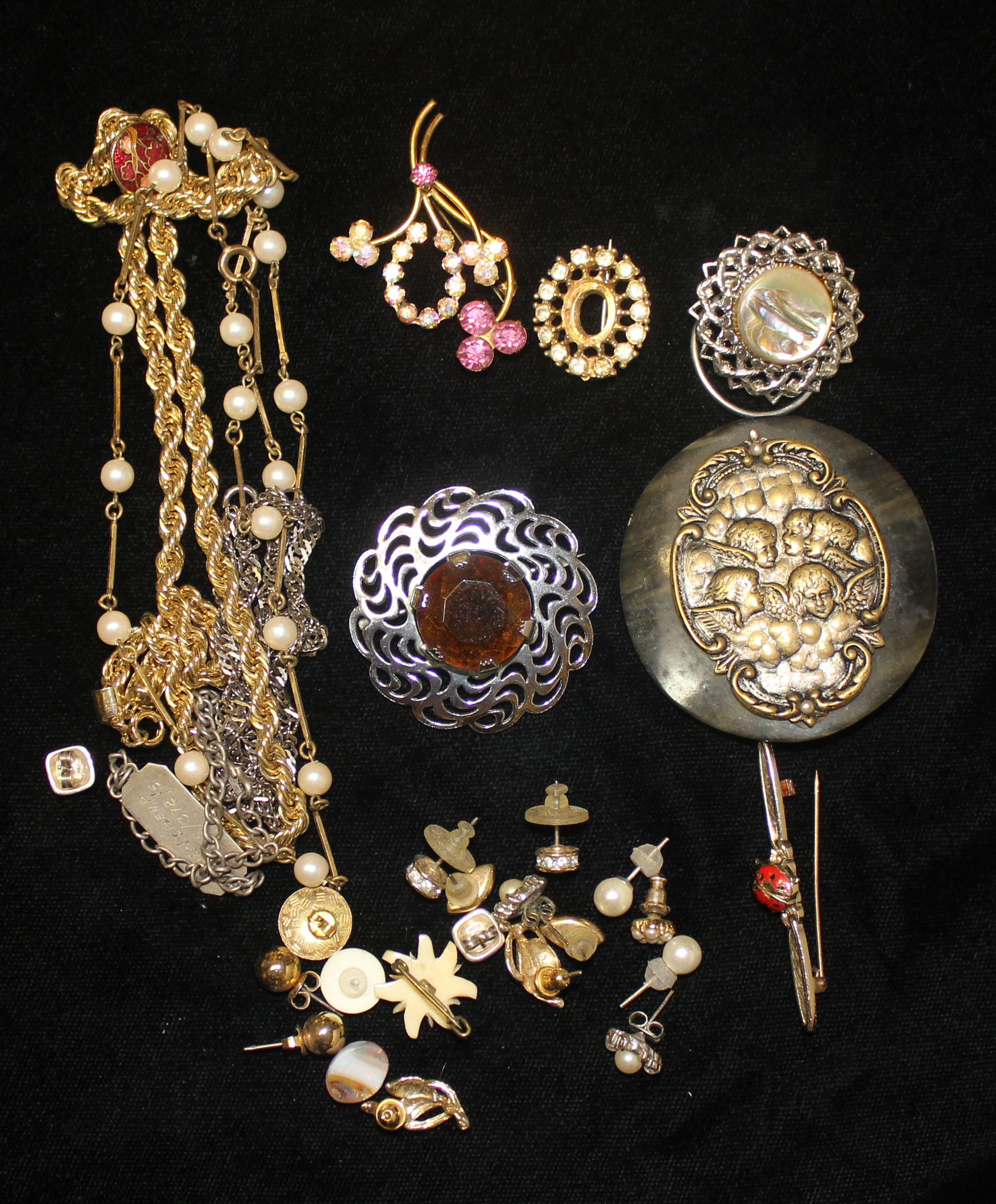 A SELECTION OF COSTUME JEWELLERY Comprising of an antique tortoise shell and brass belt buckle