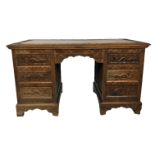 A LATE 19TH/EARLY 20TH CENTURY CHINSE FINELY CARVED HARDWOOD FREESTANDING DESK AND ARMCHAIR The