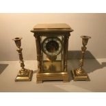 MARTI ET CIE, PARIS, A 19TH CENTURY GILT BRASS CLOCK GARNITURE SET The mantel clock set with four