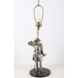 A MID 20TH CENTURY SILVER PLATED TABLE LAMP Modelled as a Cavalier sheathing his sword on circular