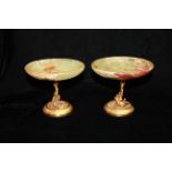 A PAIR OF 20TH CENTURY ITALIAN GILT METAL AND ONYX TAZZA DISHES The shallow green onyx bowls