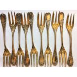 A COLLECTION OF TEN EARLY 20TH CENTURY GERMAN SILVER DESSERT FORKS Having three gilt lines