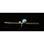 A VINTAGE 9CT GOLD, TOPAZ AND SEED PEARL BROOCH Having a single round cut stone, set with a seed