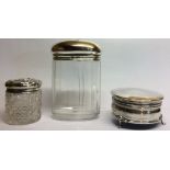 A COLLECTION OF THREE EARLY 20TH CENTURY SILVER CIRCULAR TRINKET BOXES Raised on tripod feet,