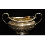 A GEORGIAN SILVER CIRCULAR SUGAR BASIN With gadrooned border and half fluted base. hallmarked