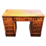 A GEORGIAN DESIGN YEW WOOD PEDESTAL DESK With a tooled tan leather writing surface above arrangement