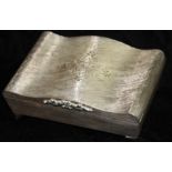 A VINTAGE ITALIAN SILVER CIGARETTE SERPENTINE BOX With textured finish and engraved floral