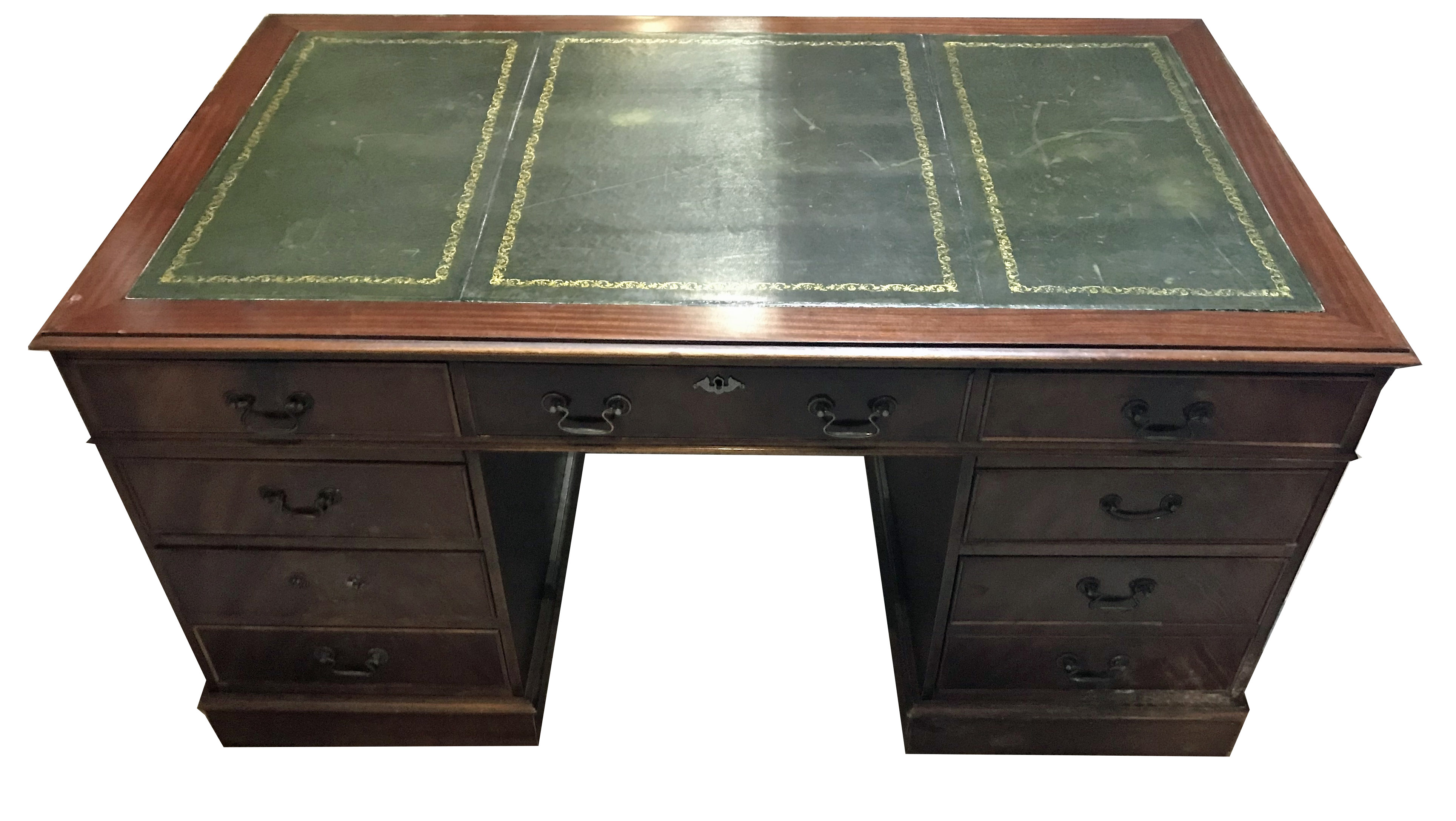 A GEORGIAN DESIGN MAHOGANY PEDESTAL DESK With tooled green leather writing surface above arrangement