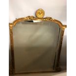 A 19TH CENTURY GILTWOOD OVERMANTEL MIRROR The arched top set with a gilt Tudor style portrait