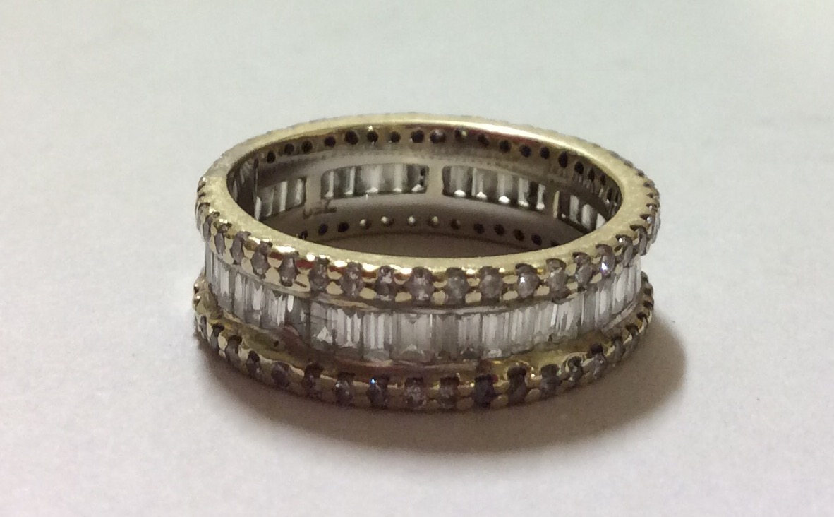 A VINTAGE 18CT GOLD AND DIAMOND FULL ETERNITY RING Having a single row of baguette cut diamonds