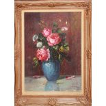 A 20TH CENTURY OIL ON CANVAS Still life, roses in a vase, monogrammed lower right and contained in a