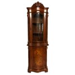 A 20TH CENTURY VICTORIAN DESIGN MAHOGANY SERPENTINE CORNER CUPBOARD With carved cornice and glazed