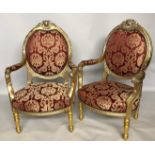 A PAIR OF FRENCH STYLE GILT ARMCHAIRS With red upholstery. (h 106cm x w 69cm x d 58cm)