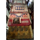 SEVEN MIDDLE EASTERN DESIGN RUGS Along with a cushion. (largest 175cm x 94cm)