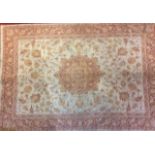 LAURA ASHLEY, A MODERN WOOLLEN RUG Cream ground with red scrolling flowers, bearing a label '