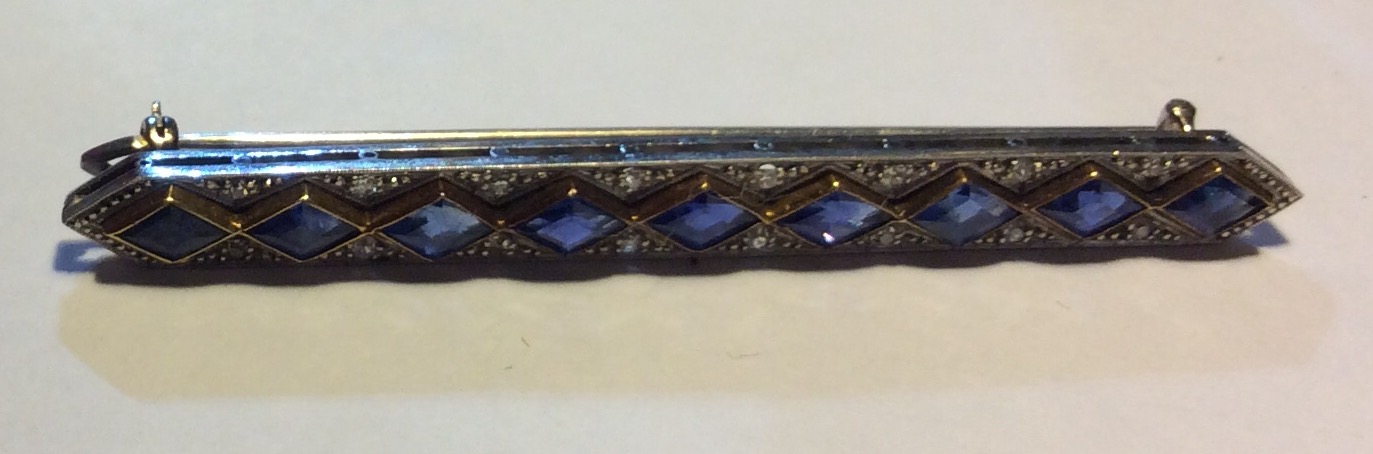 MAPPIN & WEBB, A VINTAGE WHITE METAL, SAPPHIRE AND DIAMOND BROOCH Having a single row of lozenge cut - Image 2 of 3