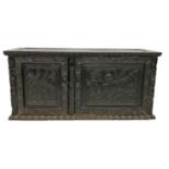 A 19TH CENTURY CHINESE (POSSIBLY ZITAN) CARVED WOOD TABLE TOP CABINET The two panelled doors