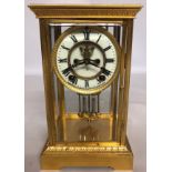 A LARGE LATE 19TH/EARLY 20TH CENTURY AMERICAN GILT BRASS FOUR GLASS LIBRARY CLOCK With twin train