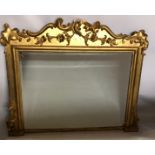 A 19TH CENTURY GILTWOOD OVERMANTEL MIRROR Having a scrolled broken pediment style frame with
