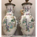 A PAIR OF ANTIQUE CHINESE PORCELAIN FAMILLE VERT OVOID VASES With hand painted decoration of figures