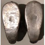 A PAIR OF 20TH CENTURY CHINESE WHITE METAL AND PORCELAIN MODEL SHOES The red grounds painted with
