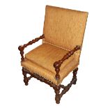 A 17TH/18TH CENTURY WALNUT OPEN UPHOLSTERED ARMCHAIR The padded back and seat over turned arms and