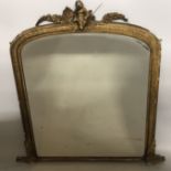 A 19TH CENTURY GILT OVERMANTLE MIRROR Surmounted with cherubs and foliage, with original glass and