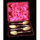 HAMILTON & INCHES, A CASED SET OF FOUR WHITE METAL FIGURAL APOSTLE SPOONS Comprising two figures
