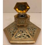 A VICTORIAN BRASS DESK HEXAGONAL INKWELL With pierced decoration of fruit and flowers.