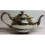 A GEORGIAN SILVER SPHERICAL TEAPOT With acanthus leaf border and handle, fluted finial and bun feet,