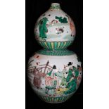 A CHINESE FAMILLE VERTE DOUBLE GOURD VASE Hand painted with lohan and elders in an exotic garden. (
