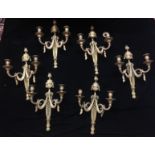 A SET OF SIX 19TH CENTURY GILT BRONZE WALL SCONCES With acorn finial, pierced mid section and swag