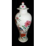 A CHIINESE QIALONG FAMILLE ROSE VASE AND COVER Decorated with a double peacock design. (37cm)