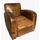 A FAUX CROCODILE TAN LEATHER UPHOLSTERED ARMCHAIR With loose cushion.