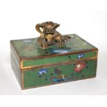 A RECTANGULAR CLOISONNÉ BOX AND COVER, CIRCA 1920 The green ground decorated with garden
